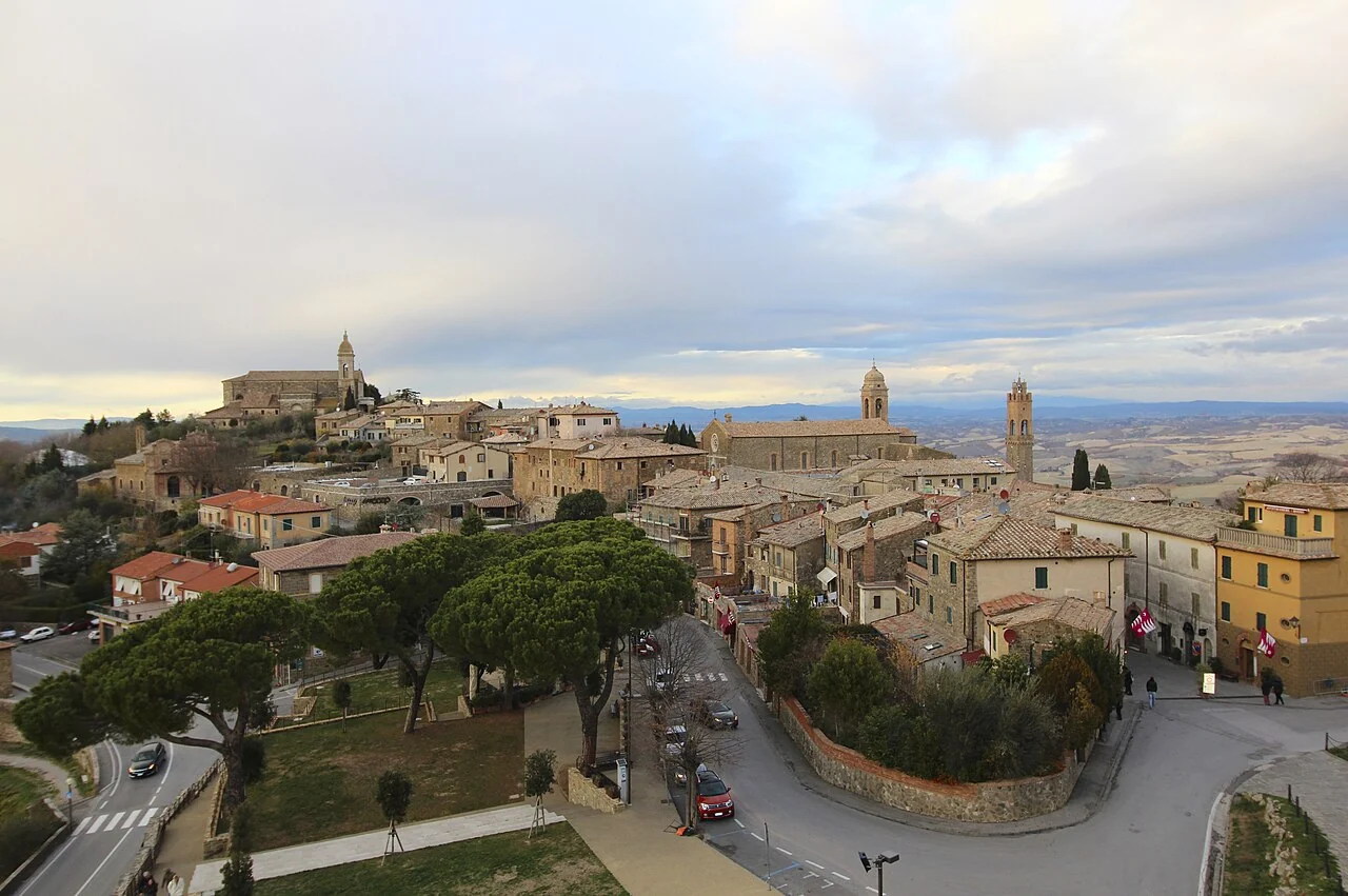 Montalcino’s tiled rooftops, stone towers and the countryside seen from the fortress