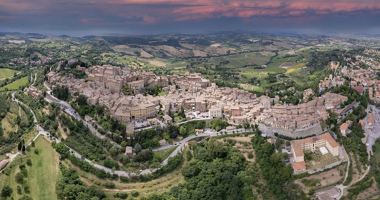 Aerial view of Montepulciano’s hilltop old town and the surrounding Tuscan countryside at dusk
