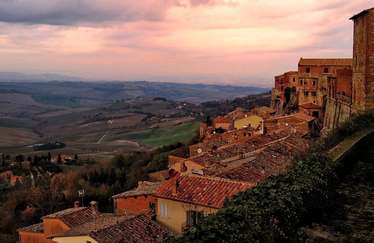 Warm evening light over Montepulciano’s rooftops and the countryside beyond