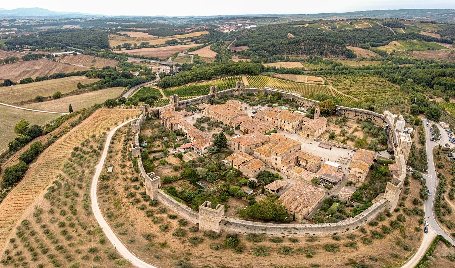 The complete medieval walls of Monteriggioni surrounding the hilltop village in Tuscany