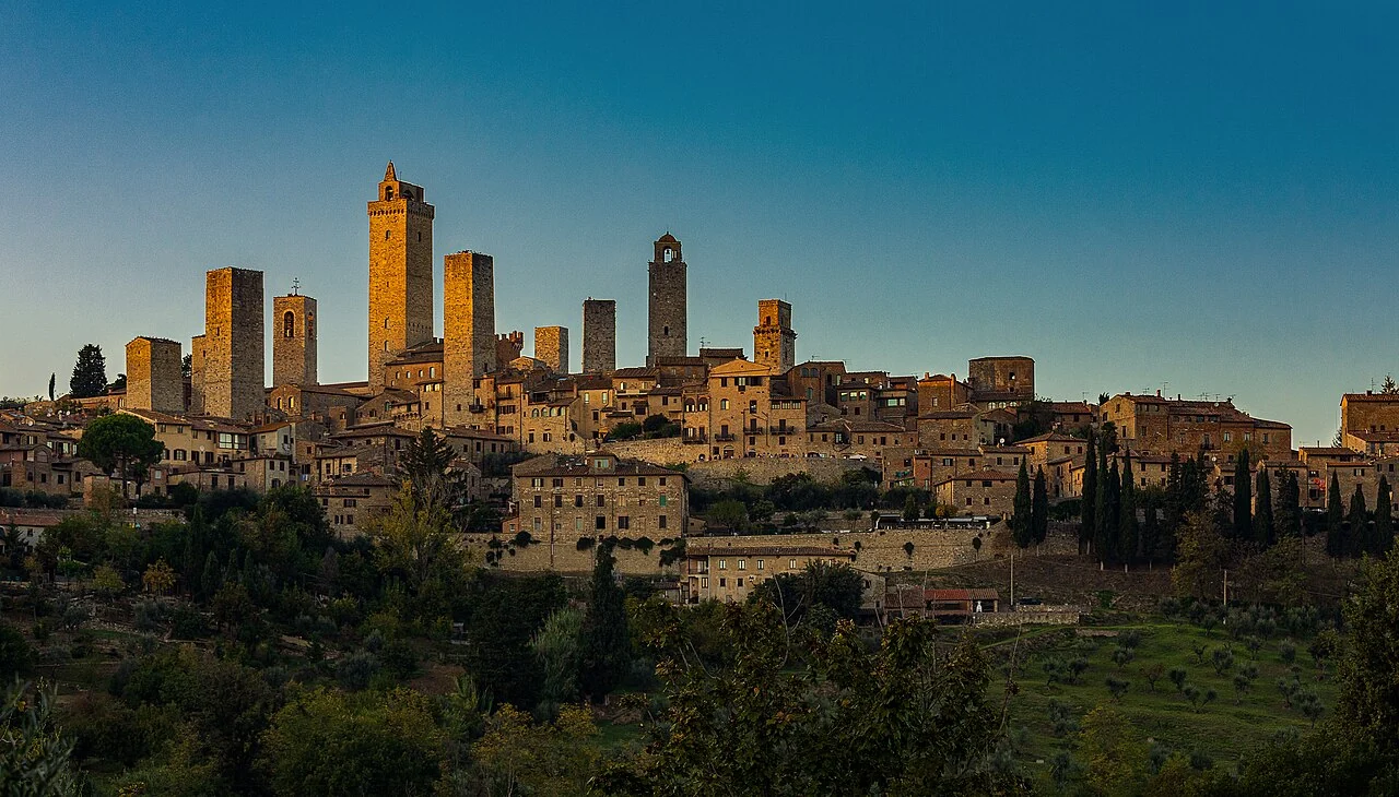 San Gimignano’s medieval towers and stone buildings in warm evening light
