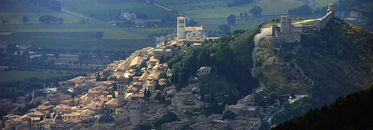 Assisi and the Basilica of Saint Francis seen across the Umbrian landscape