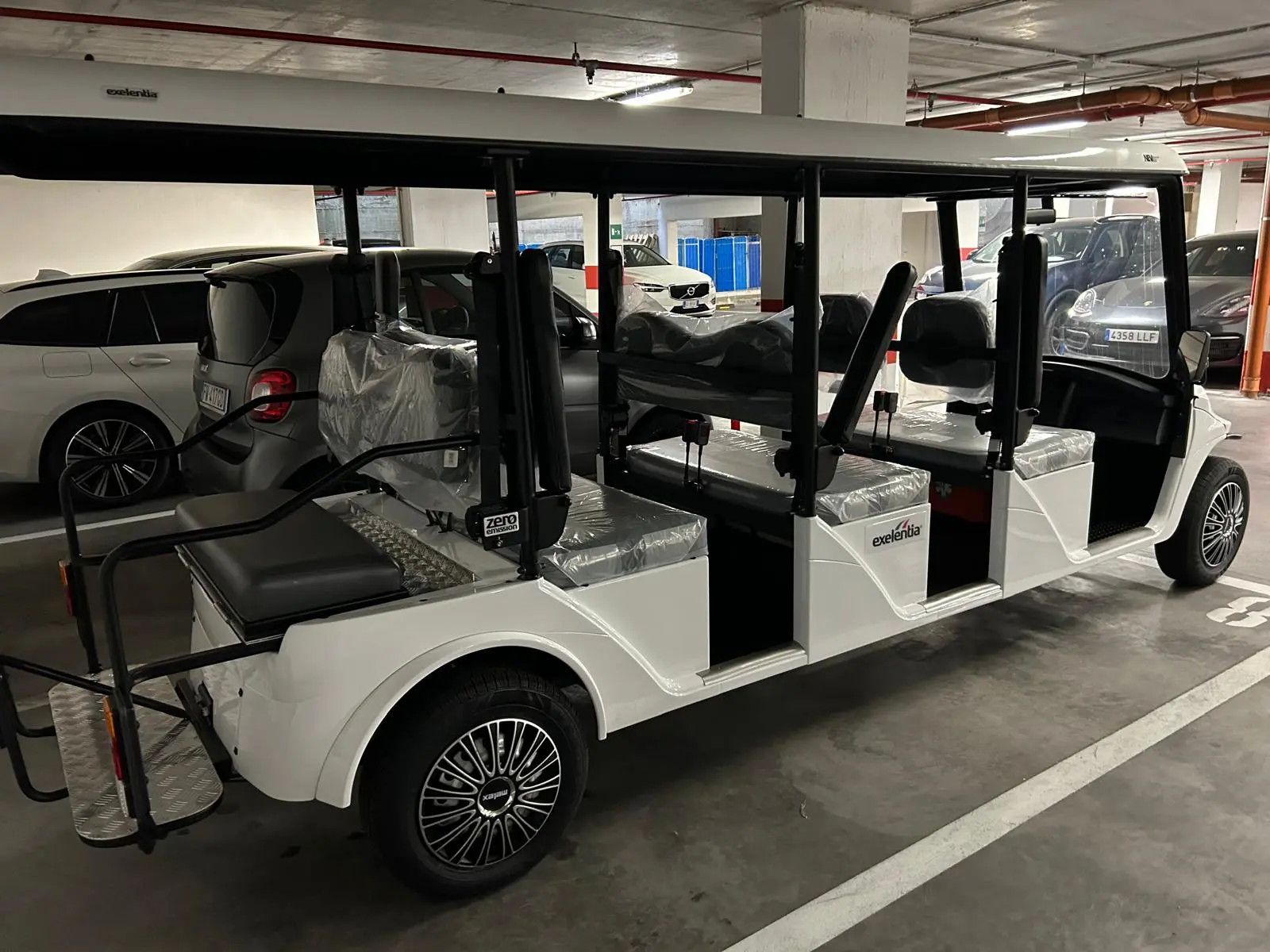Actual larger private golf cart seen from the side in Rome